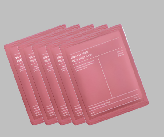Set of pink bio-collagen face masks on a white background
